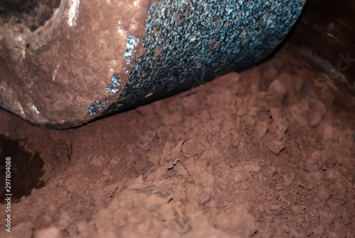 Obraz na plátně millstone of industrial melanger grind cocoa in the process of making chocolate