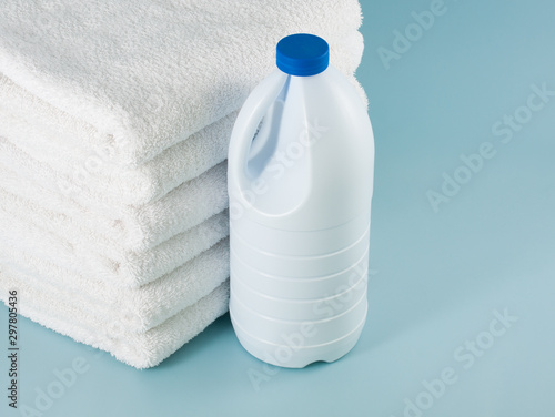 laundry launderer bleach bottles and terry towel photo