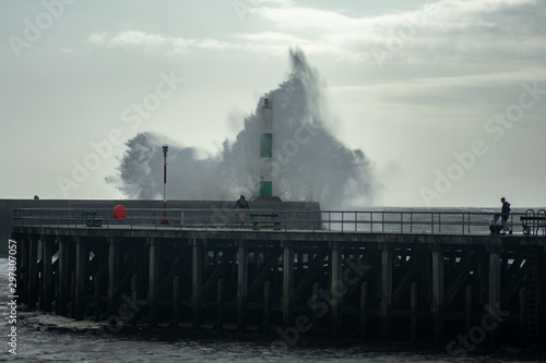 Strong winds create big waves that batter into Aberystwyth, Mid Wales sea front during the Storm season.