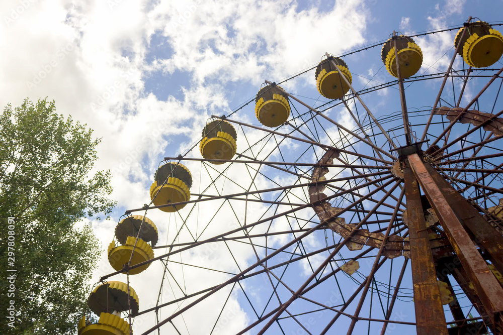 Abandoned amusement park. ferris wheel in an amusement park in Pripyat. Unhappy childhood. Abandoned amusement park. ferris wheel in an amusement park in Pripyat. Unhappy childhood.
