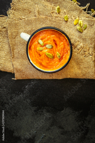 pumpkin soup or carrot cream soup (first course, delicious vegetable vitamin food) menu concept. food background. copy space. Top view