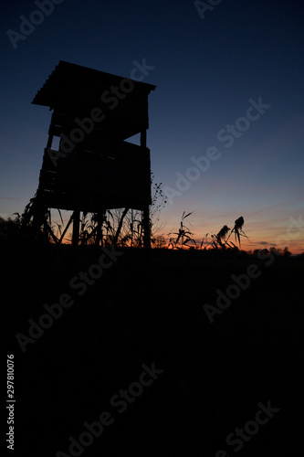 silhouette of hunting platform during sunset