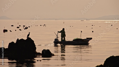 fishermen at sunset