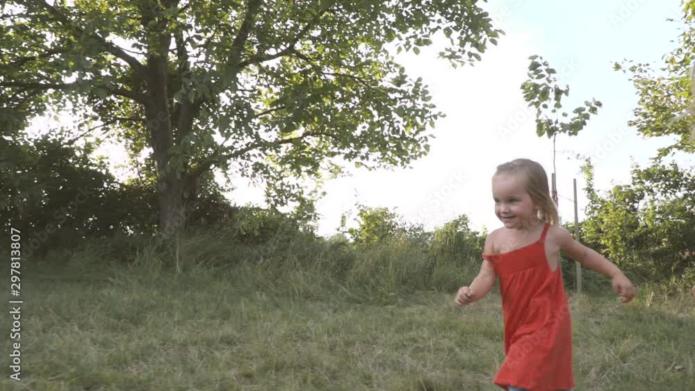 father is playing football with his two girls, daughters father is playing football with his two girls, daughters