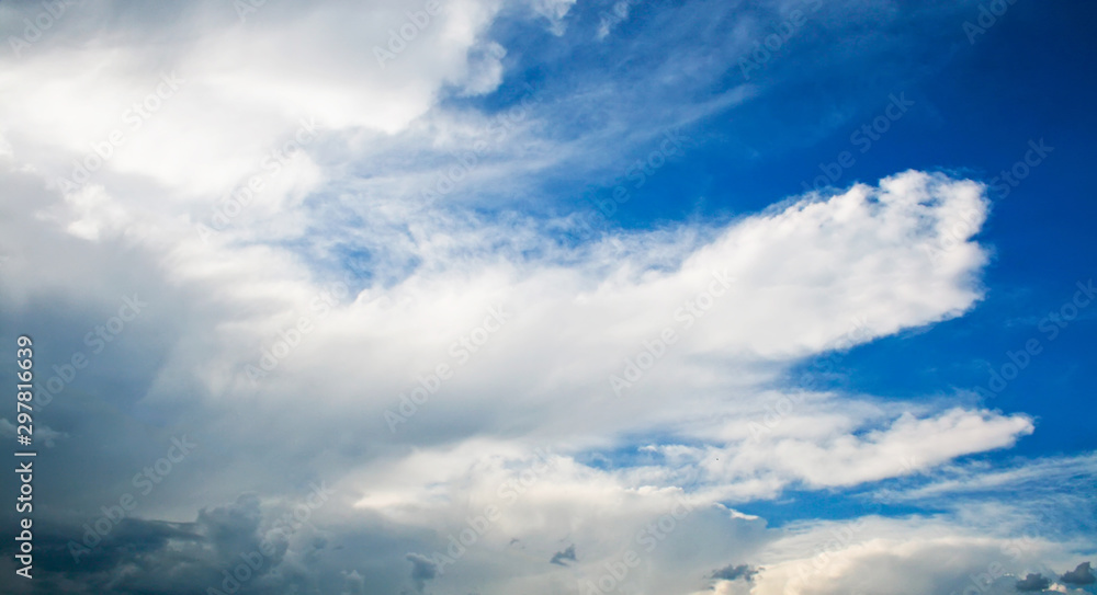 White and gray clouds on a blue sky White and gray clouds on a blue sky