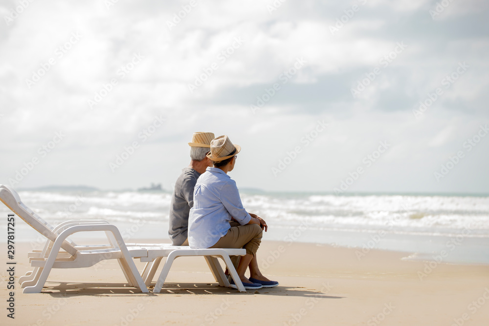 Happy asian senior couple  have fun and enjoy at the beach
