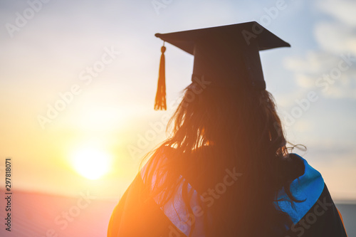 Graduates wear a black hat to stand for congratulations on graduation photo