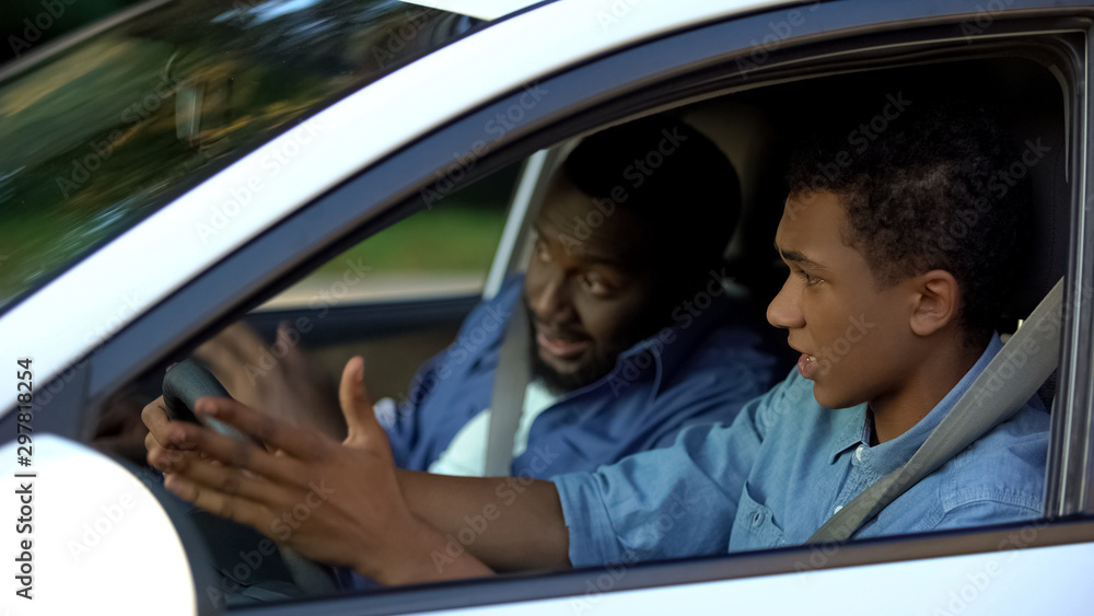 Son feeling scared of strict father teaching drive, parenthood misunderstanding Son feeling scared of strict father teaching drive, parenthood misunderstanding