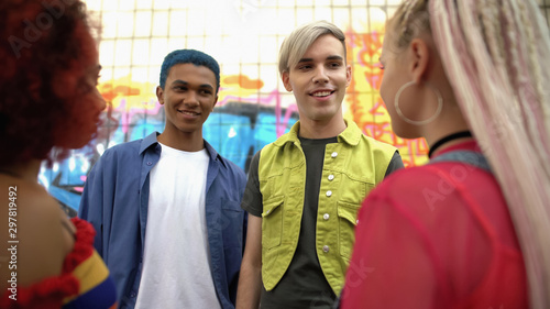 Valokuva Young male teenagers looking at pretty female friends, youth relations, sympathy