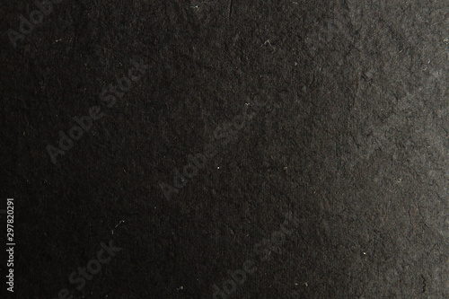 Black cardboard texture or background