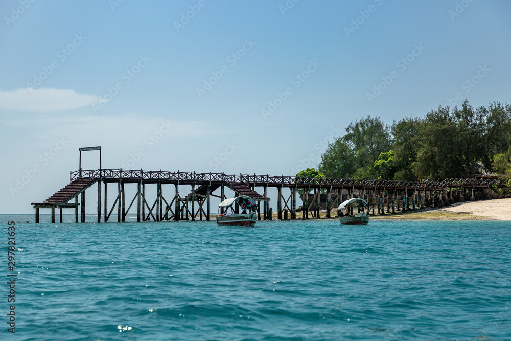 Wooden pier over blue ocean