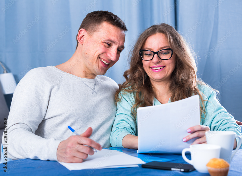 Couple signing papers