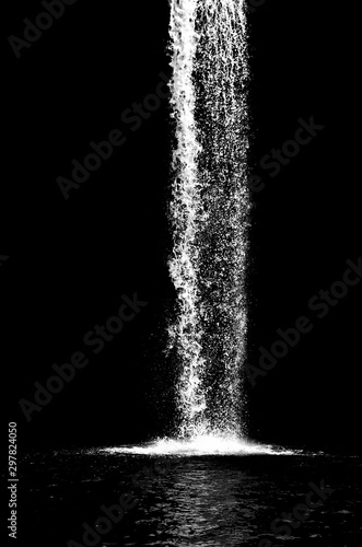Fototapeta waterfall isolated on the black background