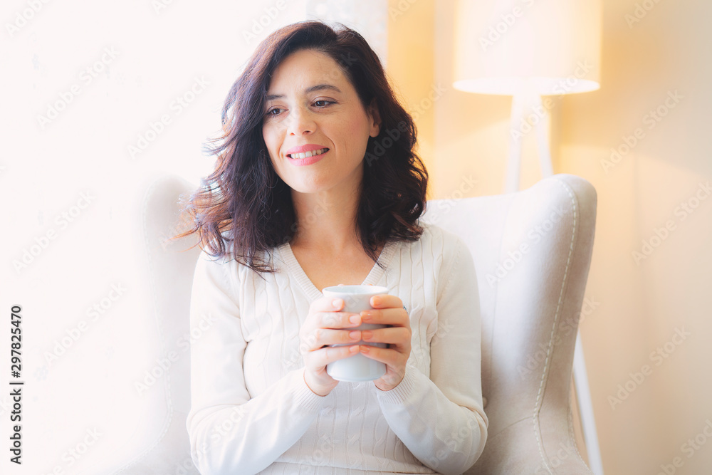 beautiful woman drinking coffee in the morning sitting by the window beautiful woman drinking coffee in the morning sitting by the window