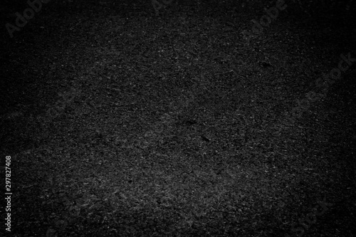 black asphalt texture background. dark tone.