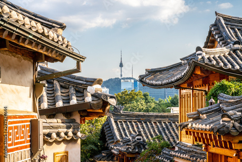 Bukchon Hanok village in Seoul with view on traditional houses roofs and tower in the distance in South Korea