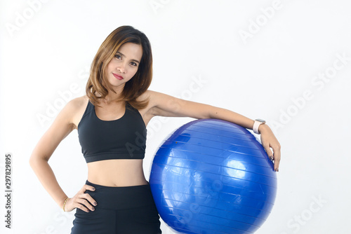 Asian sport woman holding blue ball pilates, lifestyle concept.