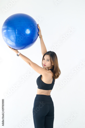 Asian sport woman holding blue ball pilates, lifestyle concept.