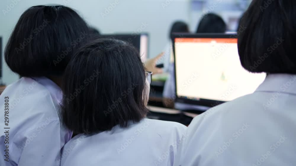 High school students in white uniforms are studying computers, Thailand, southeast Asia. High school students in white uniforms are studying computers, Thailand, southeast Asia.
