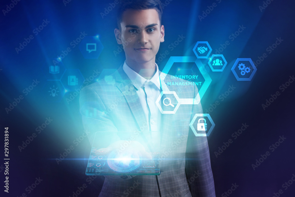 The concept of business, technology, the Internet and the network. A young entrepreneur working on a virtual screen of the future and sees the inscription: Inventory management The concept of business, technology, the Internet and the network. A young entrepreneur working on a virtual screen of the future and sees the inscription: Inventory management