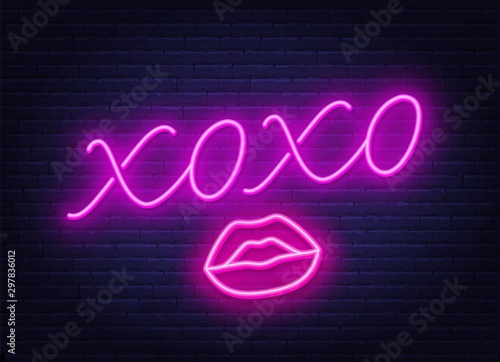 Neon sign xoxo with a kiss on a dark background. Vector illustration.