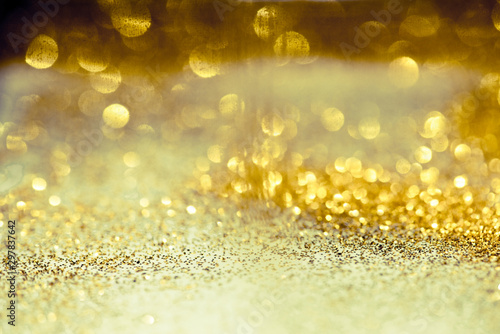 golden glitter bokeh lighting texture Blurred abstract background for birthday  anniversary  wedding  new year eve or Christmas