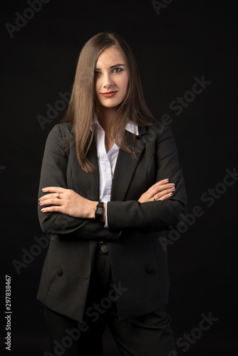 young beautiful brunette girl black background, portrait, straight long dark hair, black jacket, white blouse