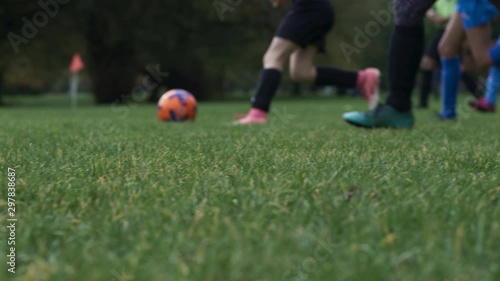 Girls playing soccer match
