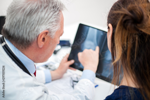 Doctor showing a radiographt to a patient