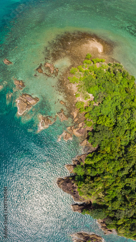 Panoramic picture Small tropical island With the day when the waves are calm Sandy beach with coconut trees.