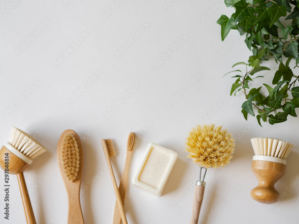 Dish washing brushes, soap, bamboo toothbrushes and green houseplant. Sustainable lifestyle zero waste concept. Clean without waste. No plastic objects. - obrazy, fototapety, plakaty 
