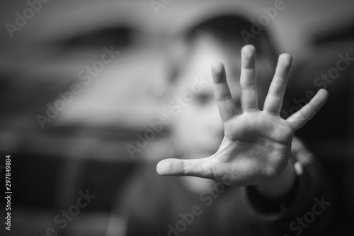 Stop hand of child, sign of discrimination or anti violence symbol.black and white. photo