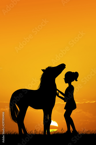 little girl and horse at sunset