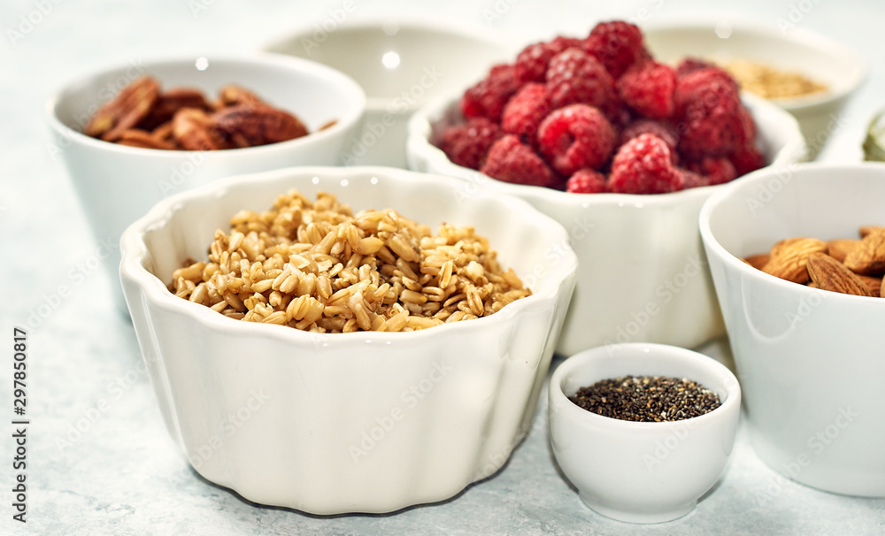 oatmeal for breakfast with raspberries, nuts and seeds oatmeal for breakfast with raspberries, nuts and seeds