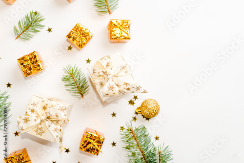 Christmas gold flat lay, composition of gifts boxes and branches