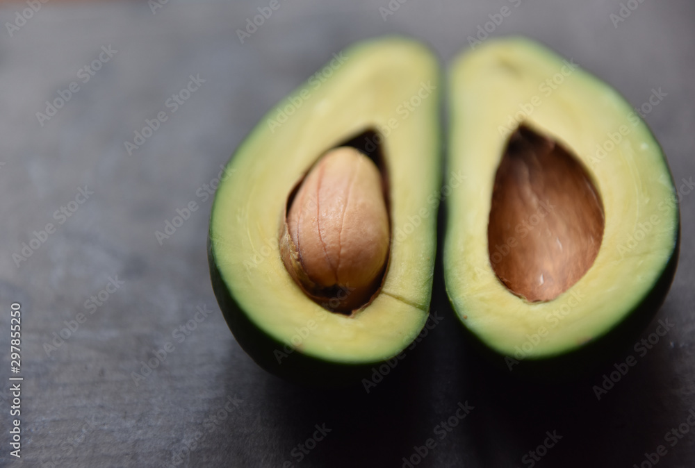 green avocado cut with a bone inside