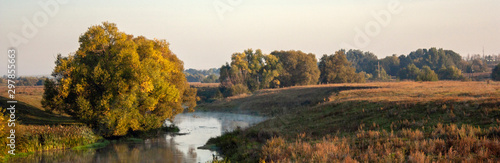 Don river at dawn in the Tula region of Russia. Trees by the river in the morning sun. © Vladimir