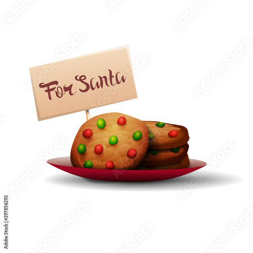 Cookies for Santa Claus with red and green candies on a plate isolated on a white background