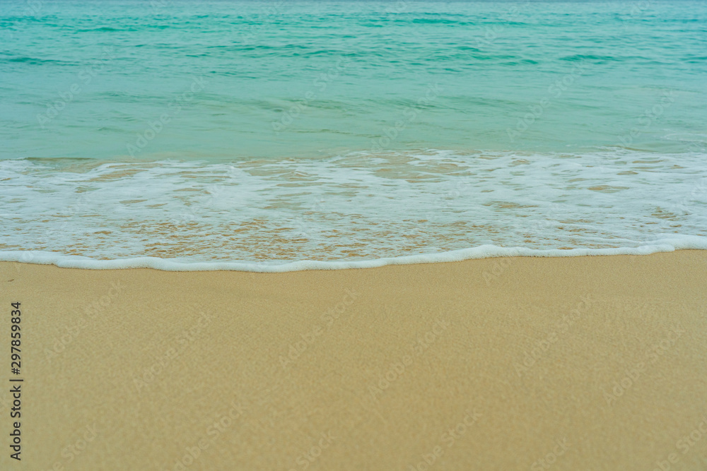 The waves of the turquoise sea swept into the sand beach. The waves of the turquoise sea swept into the sand beach.