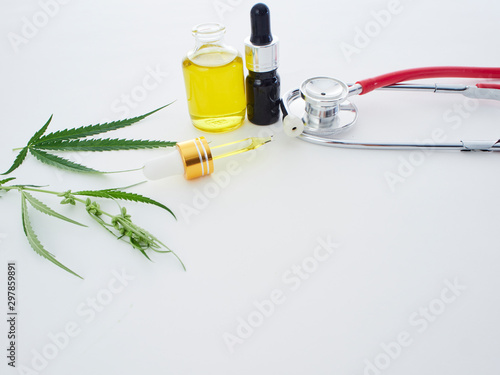 Cannabis with extract oil in a bottle and stethoscope