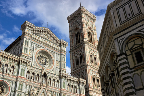 Detail of the facade of the Basilica di Santa Maria del Fiore (Florence Cathedral or Cathedral of Saint Mary of the flower), the main church of Florence, Italy. Bottom view.