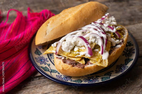 Mexican green chilaquiles sandwich with cheese also called 