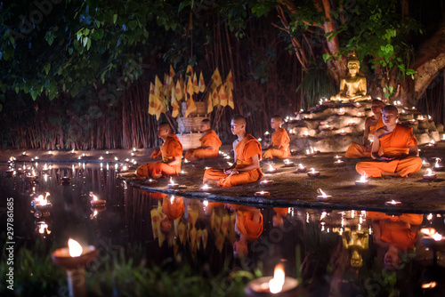 Canvas-taulu CHIANG MAI, THAILAND - May 18:  Visakha Puja Day Thai monks sitting meditate with many candle at Phan Tao temple  on May 18, 2019 in Chiang Mai, Thailand