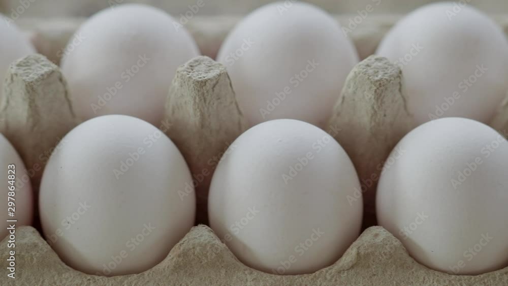 Close Up Panning Of Egg Package in artificial light Close Up Panning Of Egg Package in artificial light