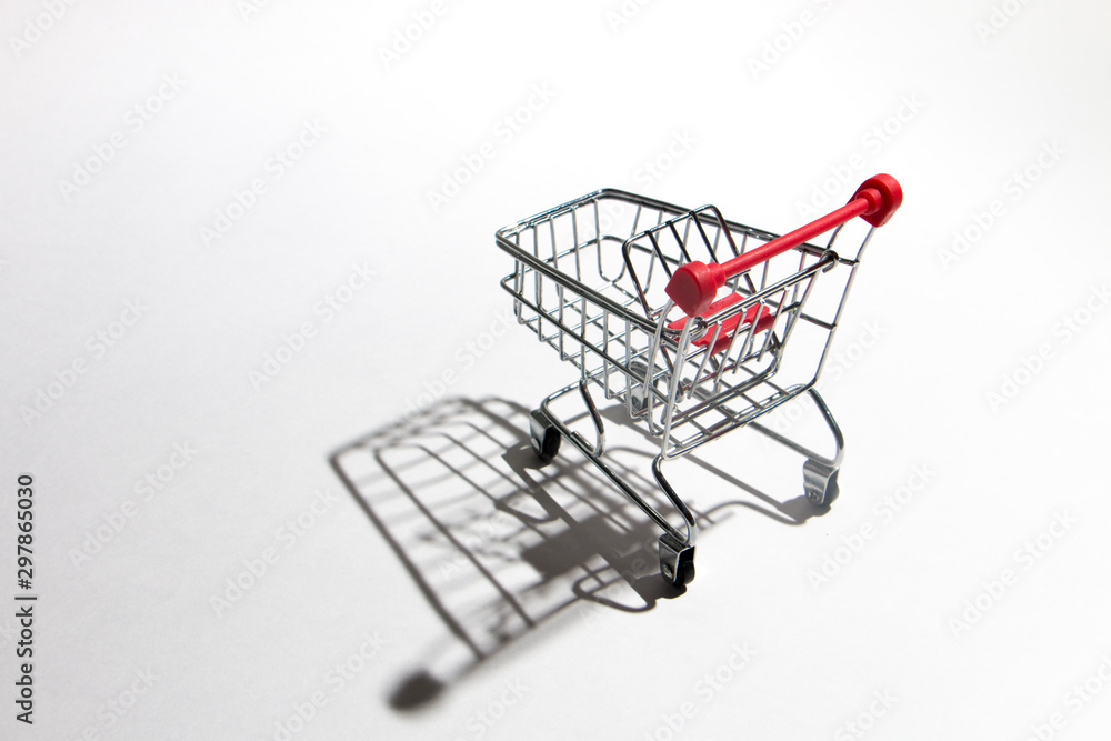 Empty shopping trolley isolated on white, closeup Empty shopping trolley isolated on white, closeup