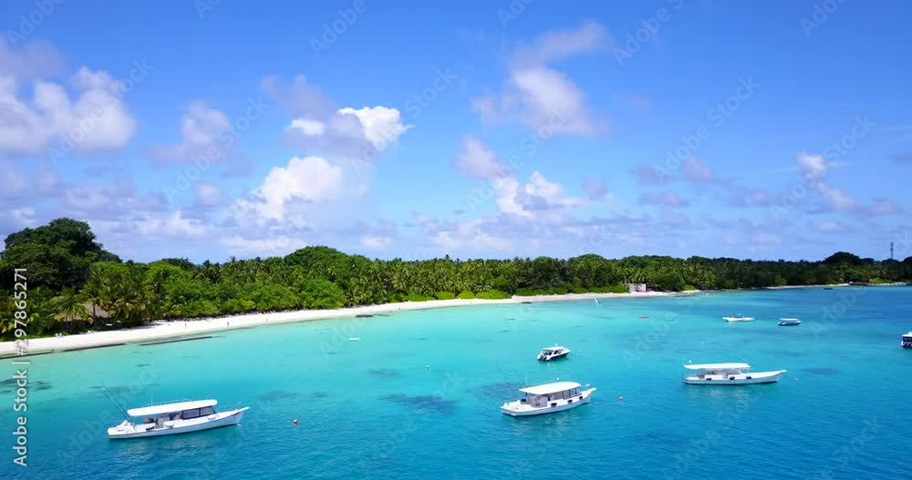 Group of boats peacefully sailing near the tropical island Group of boats peacefully sailing near the tropical island