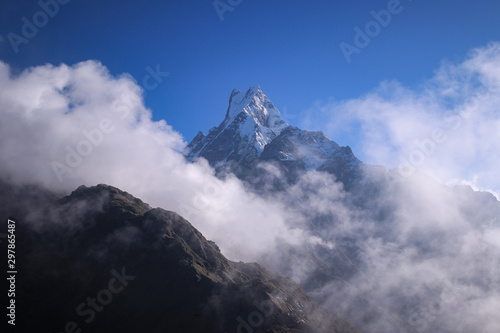 clouds and fogs surround the beautiful mountain machhapuchhre © Dipal