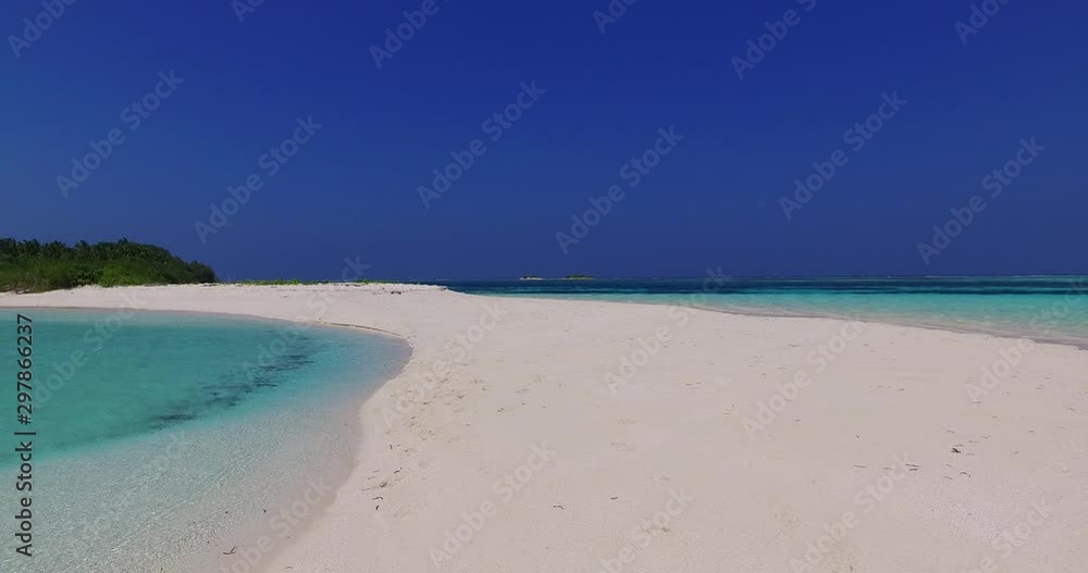 Peaceful and dreamlike view of an empty tropical beach with vegetation nearby Peaceful and dreamlike view of an empty tropical beach with vegetation nearby