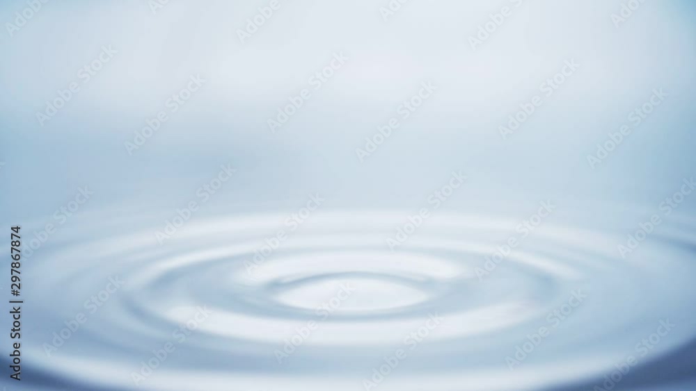 Water drop falling down. Slow motion. Blue tone Water drop falling down. Slow motion. Blue tone