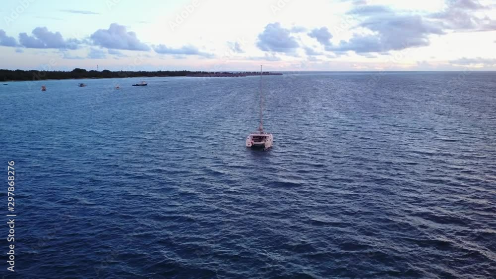 Aerial parallax, yacht moored in the tropical sea. Luxury vacation concept Aerial parallax, yacht moored in the tropical sea. Luxury vacation concept